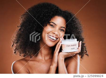 Hair, beauty and black woman with treatment for portrait aesthetic health and wellness on a brown studio background. Hairstyle, cream and moisturiser with an african american female for cosmetics Hair, beauty and black woman with treatment for portrait aesthetic health and wellness on a brown studio background. Hairstyle, cream and moisturiser with an african american female for cosmetics 125099824