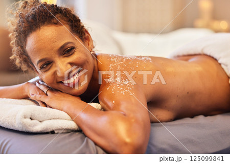 Spa, scrub and relax with black woman for exfoliation massage, skincare and luxury. Beauty, cosmetics and treatment with mature lady sea salt therapy on table for natural, wellness and body care 125099841