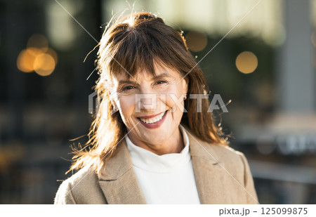 Portrait, mature woman and businesswoman in the city commuting to work or her office. Face, front and executive or leading traveling female in an urban town for travel to professional workplace 125099875