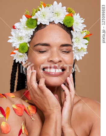Beauty, skincare and flowers in hair of black woman for natural, spring and self love. Happy, salon and luxury with face of girl model for cosmetics facial, makeup and product in studio background 125099883