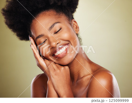 Black woman, hands and smile for facial skincare, makeup or cosmetics against a studio background. African American female smiling in satisfaction for beautiful cosmetic treatment or perfect skin 125099999