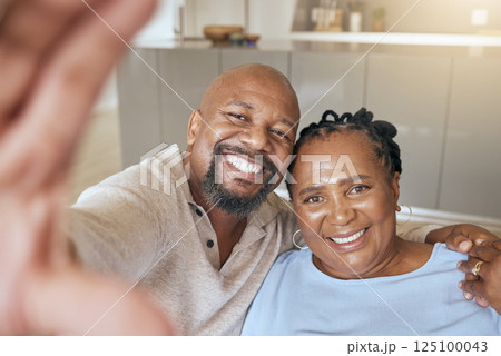 Black couple hug in selfie and relax together, happy and love at home with bonding and care in relationship. Portrait of black woman and black man with smile in picture, spending quality time. Black couple hug in selfie and relax together, happy and love at home with bonding and care in relationship. Portrait of black woman and black man with smile in picture, spending quality time. 125100043