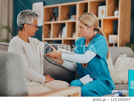 Healthcare, blood pressure and woman with doctor, home test on sofa or doctors visit in apartment living room. Senior care, nurse or caregiver with patient, trust and support in medical house call. 125100097