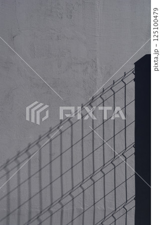 Fence shadow 125100479