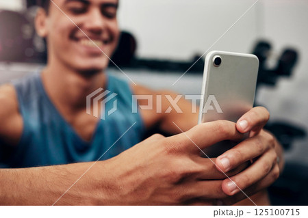 Zoom, fitness or happy black man with phone in gym for networking, social media app or communication. Hands, smile or man with smartphone, tech or success contact us website search in exercise studio 125100715