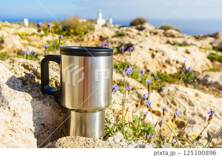 Thermal mug, thermos on nature. Travel outdoor picnic. Thermal mug, thermos on nature. Travel outdoor picnic. 125100896