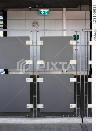 The synthetic materials wall installed in modern train station. Modern eco-friendly polymer privacy fence in building. The gray plastic material wall. 125100952