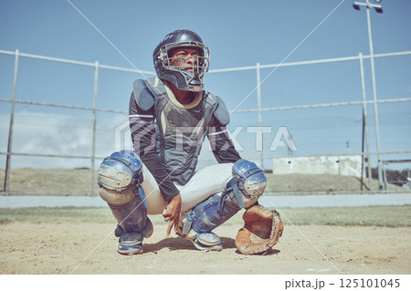 Baseball, fitness and catcher on a baseball field training for a sports game in an outdoor exercise workout in summer. Focus, wellness and healthy black man in safety gear with a secret hand gesture 125101045
