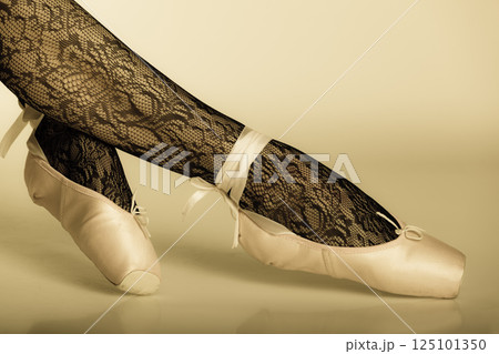 Female legs dancer in ballet shoes 125101350
