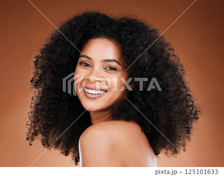 Black woman afro, beauty and smile for skincare, makeup or cosmetics against a studio background. Portrait of African American female smiling with teeth in satisfaction for cosmetic facial treatment 125101633