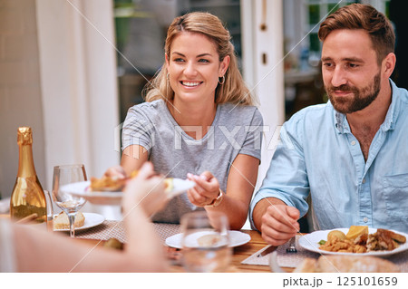 Family, food and eating together, couple have meal at family home for celebration or weekend lunch. Relax, happy and smile while bonding, party or holiday dinner with happiness and nutrition. Family, food and eating together, couple have meal at family home for celebration or weekend lunch. Relax, happy and smile while bonding, party or holiday dinner with happiness and nutrition. 125101659