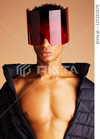 Beauty, futuristic fashion and man in sunglasses with creative cyberpunk style, modern accessory and trend setting sci fi eyewear. Black man, artistic red glass visor and future of edgy new clothing 125101678