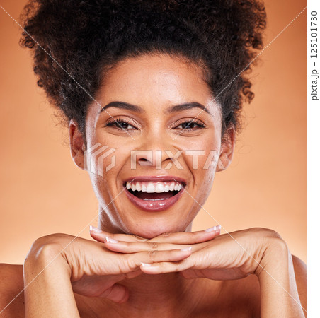 Face, beauty and skincare with a model black woman happy in studio on a beige background for wellness. Luxury, portrait and cosmetics with an attractive young female proud of her treatment routine 125101730