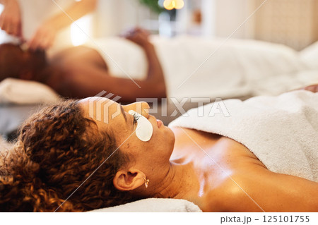 Spa, eye patch and woman with skincare, face beauty and relax for luxury treatment, wellness and health. Skin therapy, relacing or female with facial product for cosmetic health and relaxing in towel 125101755