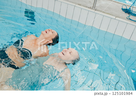Swimming pool, fitness and physiotherapy with senior women for training, wellness and sports exercise. Relax, peace and workout with elderly friends in water for health, retirement and rehabilitation Swimming pool, fitness and physiotherapy with senior women for training, wellness and sports exercise. Relax, peace and workout with elderly friends in water for health, retirement and rehabilitation 125101984