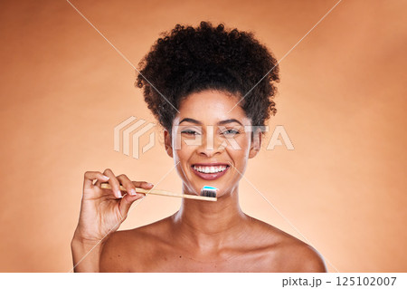 Black woman, portrait and toothbrush for cleaning, teeth and dental health or wellness on a brown studio background. Oral, health and brushing teeth with african american woman with oral hygiene 125102007