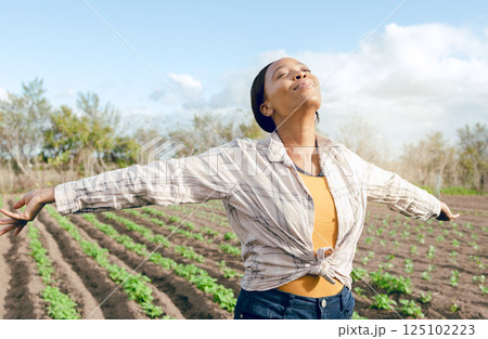 Farmer, freedom and woman feeling carefree and joy on agriculture field or plantation before harvest. Free, african american female and eco friendly field for ecology, eco and earth for farming Farmer, freedom and woman feeling carefree and joy on agriculture field or plantation before harvest. Free, african american female and eco friendly field for ecology, eco and earth for farming 125102223