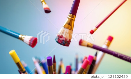 Floating paintbrushes and pencils in a colorful artistic scene 125102429