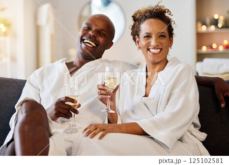 Spa, portrait and black couple champagne toast for marriage, wellness and love together with joyful smile. Happy, celebrate and health of married people enjoying luxury anniversary staycation. 125102581