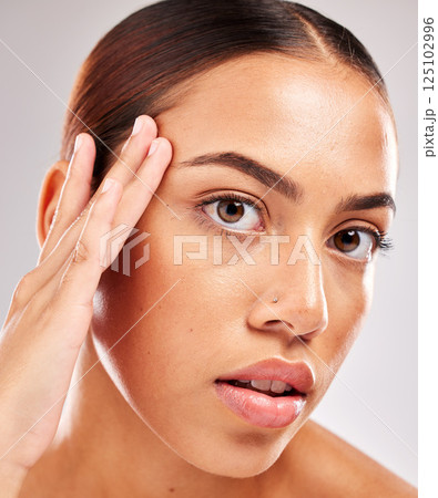 Skincare, health and headshot portrait of a woman with a wellness, natural and face routine in a studio. Beauty, cosmetics and girl model from Brazil with healthy skin isolated by a gray background. 125102996
