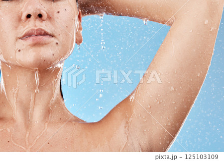 Shower, water and woman cleaning body for self care treatment, hygiene or daily bathroom routine. Body care, healthcare and wellness girl washing skin for natural skincare isolated on blue background Shower, water and woman cleaning body for self care treatment, hygiene or daily bathroom routine. Body care, healthcare and wellness girl washing skin for natural skincare isolated on blue background 125103109