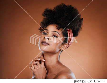 Beauty, fashion and black woman with nature hair or afro on brown studio background for skincare, self care and hair care. Portrait of African model with smile for cosmetics, make up and dermatology Beauty, fashion and black woman with nature hair or afro on brown studio background for skincare, self care and hair care. Portrait of African model with smile for cosmetics, make up and dermatology 125103200