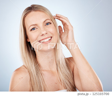 Health, beauty and straight hair portrait of blonde model feeling smooth, soft and luxury texture. Shine, cosmetic and happy woman satisfied with salon hair care on gray studio mock up. Health, beauty and straight hair portrait of blonde model feeling smooth, soft and luxury texture. Shine, cosmetic and happy woman satisfied with salon hair care on gray studio mock up. 125103700