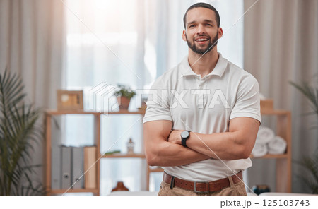 Physiotherapist, spa and chiropractor man employee portrait ready for physiotherapy and consultation. Happy physical therapy and support worker feeling proud from health therapy clinic success Physiotherapist, spa and chiropractor man employee portrait ready for physiotherapy and consultation. Happy physical therapy and support worker feeling proud from health therapy clinic success 125103743