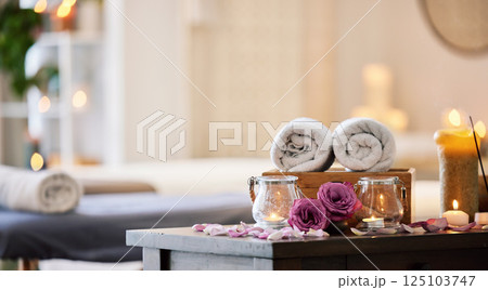 Relax, peace and calm at a luxury spa for wellness, health and zen during a massage. Candles, flowers and healing environment at a salon for stress relief, relaxation and physical therapy on vacation 125103747