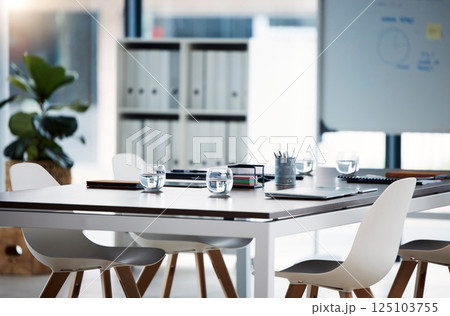 Empty meeting, conference and business room for presentation, corporate strategy discussion and training workshop. Modern chair, brainstorming and table prepared documents for collaboration boardroom 125103755