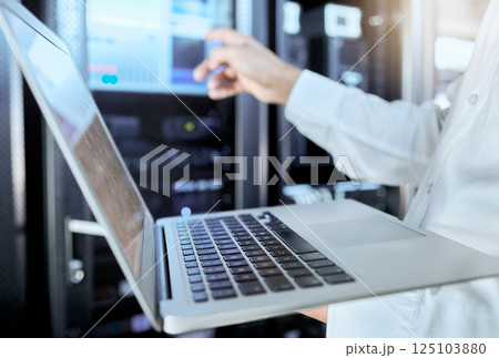 Server room, network and laptop with businessman in data center for engineering, technology and cloud computing. Cybersecurity, internet and mining with hands of employee for hardware maintenance Server room, network and laptop with businessman in data center for engineering, technology and cloud computing. Cybersecurity, internet and mining with hands of employee for hardware maintenance 125103880