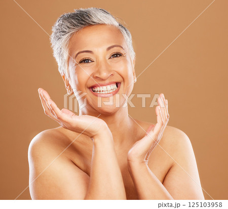 Skincare, beauty and portrait of senior black woman with smile on orange background in studio. Wellness, happiness and old female model for anti aging beauty products, skincare products and cosmetics Skincare, beauty and portrait of senior black woman with smile on orange background in studio. Wellness, happiness and old female model for anti aging beauty products, skincare products and cosmetics 125103958