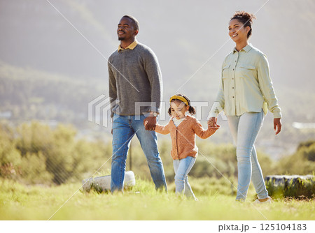 Happy family, walking and relax at a park with girl and parents, holding hands and enjoy their bond, freedom and trust. Love, black family and child with mom and dad on a walk in the countryside Happy family, walking and relax at a park with girl and parents, holding hands and enjoy their bond, freedom and trust. Love, black family and child with mom and dad on a walk in the countryside 125104183