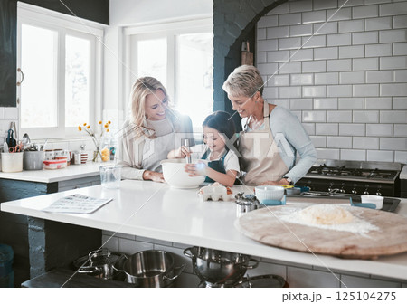 Happy, joyful and loving mother and grandmother cooking, baking and preparing food with their daughter and grandchild. Happy, cheerful and carefree girl learning to bake with her family in kitchen Happy, joyful and loving mother and grandmother cooking, baking and preparing food with their daughter and grandchild. Happy, cheerful and carefree girl learning to bake with her family in kitchen 125104275