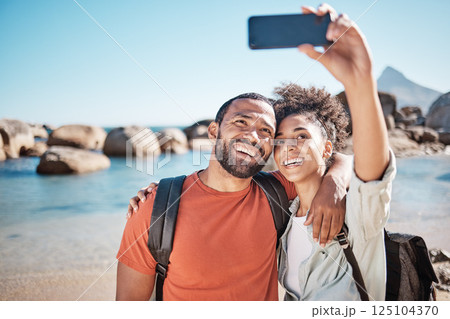 Couple, love and phone selfie on beach for travel adventure or summer vacation. Happy man, woman smile and photography for holiday lifestyle on 5g smartphone for social media at ocean water outdoors 125104370