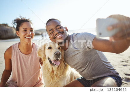 Couple, phone selfie and dog on beach for social media post, video call or memory vlog by ocean, sea or water. Smile, happy or bonding black woman, man and golden retriever in mobile photography tech 125104653