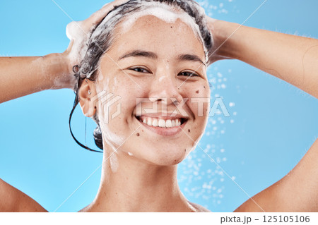 Hair shampoo, portrait and woman in shower in studio isolated on a blue background. Hygiene, water splash and healthy female model from Canada cleaning, bathing and washing for wellness and hair care Hair shampoo, portrait and woman in shower in studio isolated on a blue background. Hygiene, water splash and healthy female model from Canada cleaning, bathing and washing for wellness and hair care 125105106