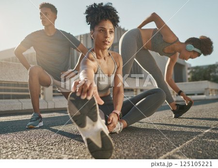 Fitness, team and friends stretching in city street for exercise run, marathon training run or cardio performance workout. Health commitment, focus and black people warm up while listening to music 125105221