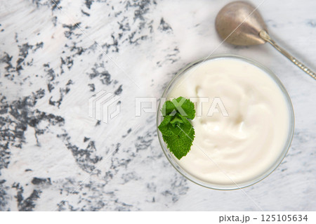 Homemade yogurt or sour cream in a bowl 125105634