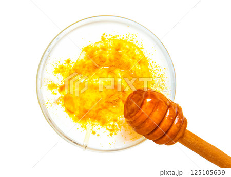 Natural face mask with turmeric powder and yogurt. Natural cosmetics isolated on white background. top view. 125105639