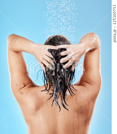 Beauty, skincare and haircare, woman in shower from back on blue background, shampoo and hygiene routine in morning. Healthy model in water cleaning hair with running water for clean fresh lifestyle. Beauty, skincare and haircare, woman in shower from back on blue background, shampoo and hygiene routine in morning. Healthy model in water cleaning hair with running water for clean fresh lifestyle. 125105751