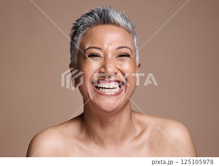 Skincare, beauty and portrait of a senior woman with a smile, happy and relax against a brown mockup studio background. Wellness, luxury and face of an elderly model in retirement and happiness Skincare, beauty and portrait of a senior woman with a smile, happy and relax against a brown mockup studio background. Wellness, luxury and face of an elderly model in retirement and happiness 125105978