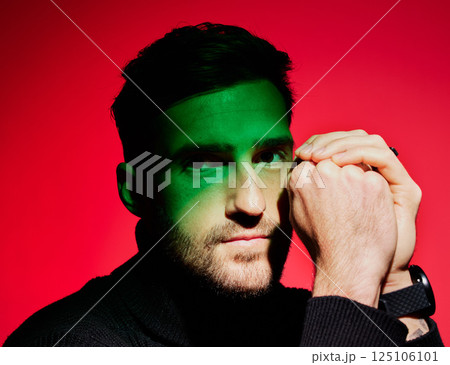 Man model, green light and fashion for beauty, creative and luxury designer aesthetic portrait. Fashion model with cosmetic skincare, wellness and face with color, art and cool shadow lighting Man model, green light and fashion for beauty, creative and luxury designer aesthetic portrait. Fashion model with cosmetic skincare, wellness and face with color, art and cool shadow lighting 125106101