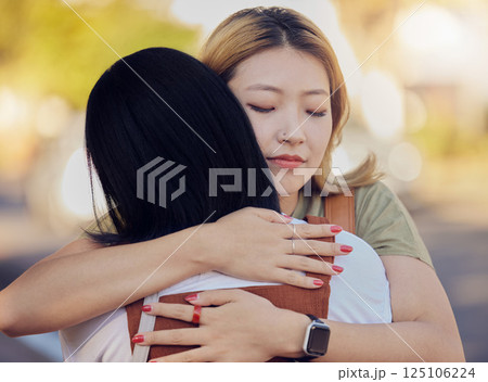 Woman, friends and love hug in city outdoors together for sorry, support and lesbian couple forgive in street. Asian people, friendship and emotional hugging for grief or sadness in urban city street Woman, friends and love hug in city outdoors together for sorry, support and lesbian couple forgive in street. Asian people, friendship and emotional hugging for grief or sadness in urban city street 125106224