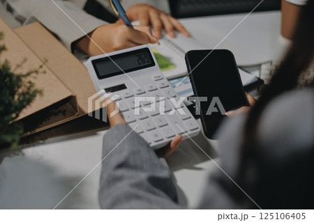 Portrait of Asian young female working on laptop at office 125106405