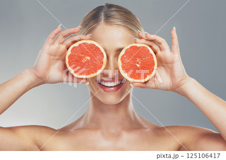 Woman, beauty and product with grapefruit skincare for healthy skin, self care and natural cosmetics glow. Facial citrus moisturizer, happy face and moisturizing vitamin c organic cosmetology routine Woman, beauty and product with grapefruit skincare for healthy skin, self care and natural cosmetics glow. Facial citrus moisturizer, happy face and moisturizing vitamin c organic cosmetology routine 125106417