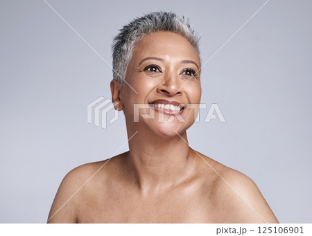 Senior model, beauty and smile on face for makeup, cosmetics and skincare with vision in studio. Elderly black woman, cosmetic wellness and happy for skin glow, radiant and health by grey background Senior model, beauty and smile on face for makeup, cosmetics and skincare with vision in studio. Elderly black woman, cosmetic wellness and happy for skin glow, radiant and health by grey background 125106901