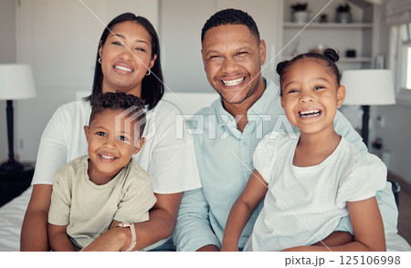 Family, relax and happy together in home for love, care and support portrait. Black family, smile and parents spend quality time with children on vacation or holiday in family home for happiness 125106998