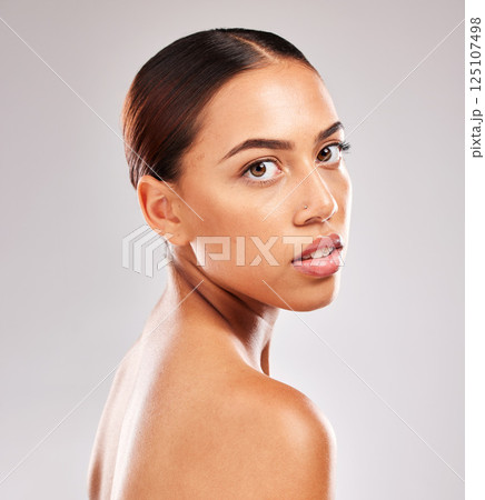 Skincare, beauty and portrait of Latin woman in studio on white background for body care. Wellness, healthy skin and face of young female model for makeup, dermatology and cosmetic beauty products Skincare, beauty and portrait of Latin woman in studio on white background for body care. Wellness, healthy skin and face of young female model for makeup, dermatology and cosmetic beauty products 125107498