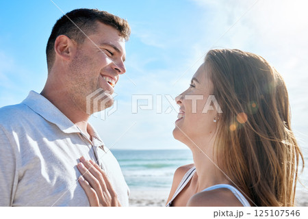 Smile, love and couple at the beach while on holiday or romantic summer honeymoon in greece. Happy, care and calm man and woman with romance, embracing and bonding in nature by the ocean on vacation Smile, love and couple at the beach while on holiday or romantic summer honeymoon in greece. Happy, care and calm man and woman with romance, embracing and bonding in nature by the ocean on vacation 125107546